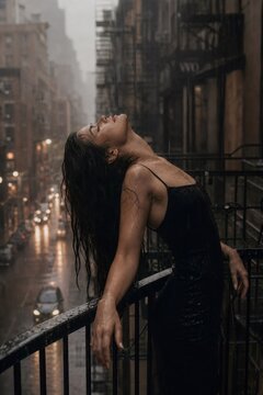 Woman feeling freedom and catharsis during city rain