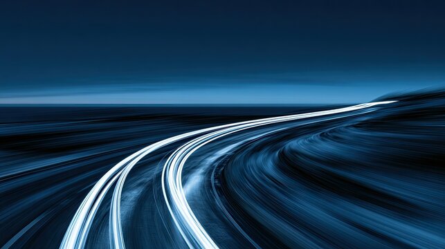 Streaking blue and white lights create a sense of rapid motion on a dark highway