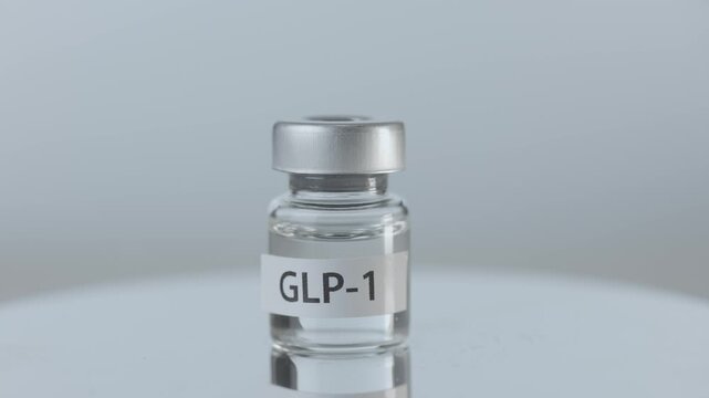 Clear medicine liquid inside glass vial offers modern glp 1 therapy treatment for clinic patient wellness, targeting weight loss management, obesity diabetes clinical health care injection