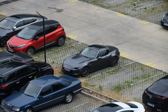 July 7, 2026, Tbilisi, Georgia High-Angle View of Various Cars Parked in a Concrete Parking Lot