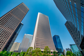 Fototapeta premium Shinjuku street buildings and urban scene on a beautiful sunny spring day Tokyo Japan Tokyo,