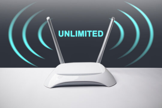A conceptual image featuring a minimalist white wireless internet router with two antennas, surrounded by glowing blue signal waves and the overlay text UNLIMITED.