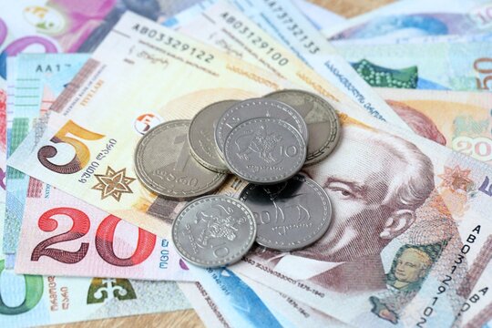 Georgian lari money bills and coins on table. Georgia cash of GEL currency close up