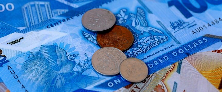 Trinidad and Tobago dollar money bills and coins on table. Trinidad and Tobago cash of TTD currency