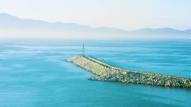 Ensenada, Mexico &ndash; July 8, 2026: Breakwater lighthouse at Port of Ensenada entrance