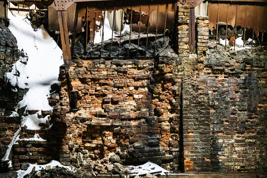 broken brick wall in abandoned factory building