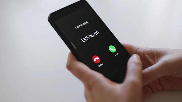 Smartphone screen displaying incoming call from unknown caller.