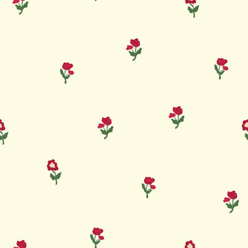 Seamless pattern with ditsy small red flowers and green leaves on cream background, vintage floral texture for textile and wrapping paper