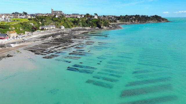 Aerial drone view of Cancale oyster farming on the Brittany coast, France, capturing the famous shellfish cultivation area