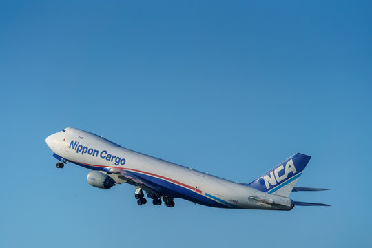 A Nippon Cargo Airlines (NCA) Boeing 747-8F freighter climbing after takeoff at Narita International Airport on November 4, 2024 in Narita, Japan.