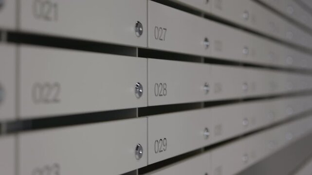 Residential mailbox row in modern apartment building lobby