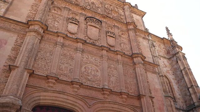 Ornate Plateresque facade of the historical University of Salamanca in Spain with intricate details and sculptures