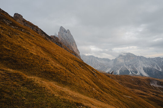 Scenic landscape view of the Dolomites Alps featuring the Odle mountain range and Seceda peak in Italy. Captures dramatic alpine scenery,