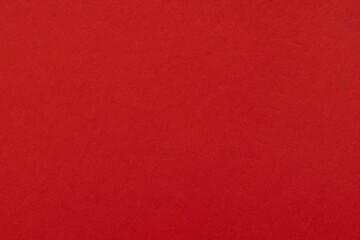 Fototapeta premium Vibrant Red Paper Texture Background,A high-quality, close-up photograph of a vibrant red paper surface featuring a subtle, natural texture, perfect for use as a minimalist background or graphic.