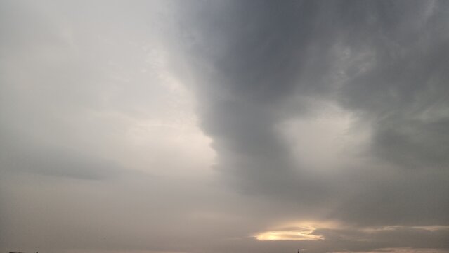 Dense gray cumulus clouds texture on an overcast stormy day