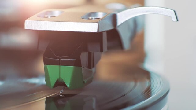 Turntable stylus tracking LP groove during vinyl playback, tonearm closeup with warm lens flare, analog music experience, shallow depth of field