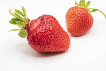 Ripe red strawberries isolated on white background with fresh organic berries and detailed natural texture close up © Olha