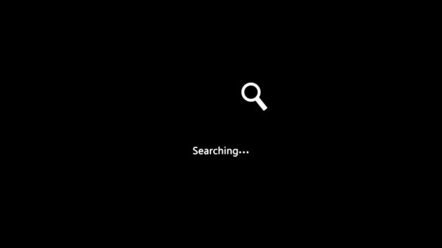 A white magnifying glass icon appears centered on black screen with searching written below it to denote an active information scan