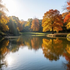 Obraz premium Autumn landscape with colorful trees reflected in a calm pond under