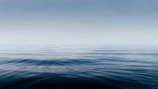 Serene ocean view with endless calm water and gentle waves under a peaceful gradient sky