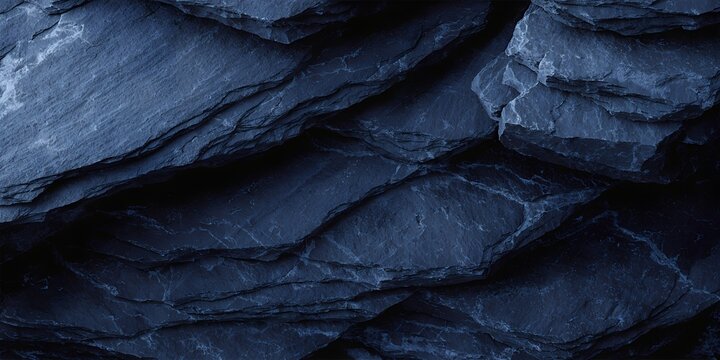 Dark blue background with a slate texture, featuring rough, cracked layers of stone and a natural, rugged surface. Abstract design.