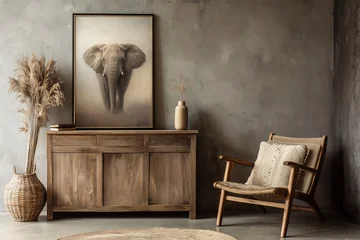Living room interior decor with an armchair and a framed photo print of an elephant on wooden furniture, sepia rustix african style © Delphotostock