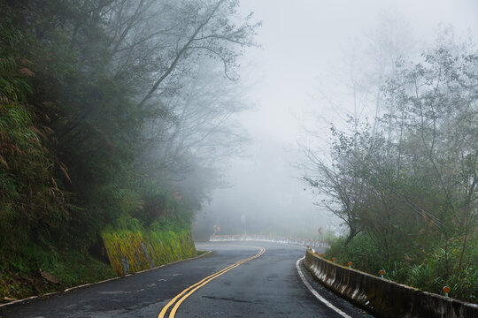 Wet Mountain Road in Dense Fog