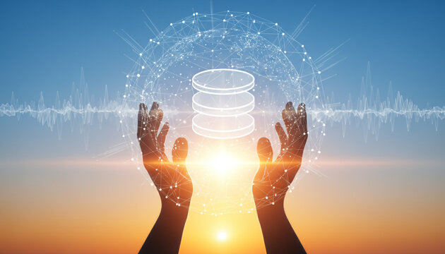 Protecting data with hands holding database and network connections at sunset.
