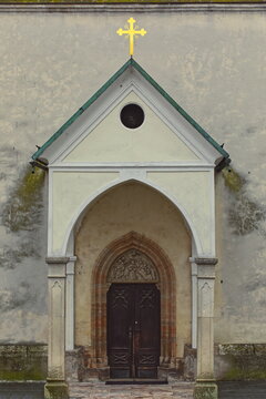 Pointed arch doorway under a neo-Gothic shed on the XIX century renewed W facade of the St.Jakob church (Cerkev sv.Jakoba). Skofja Loka-Slovenia-143