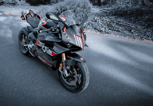 Ducati Panigale V4 SP2 with Top Gun livery on forest road editorial photo