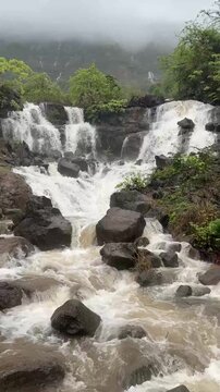 Changewadi Twin Waterfall cascading through lush monsoon greenery