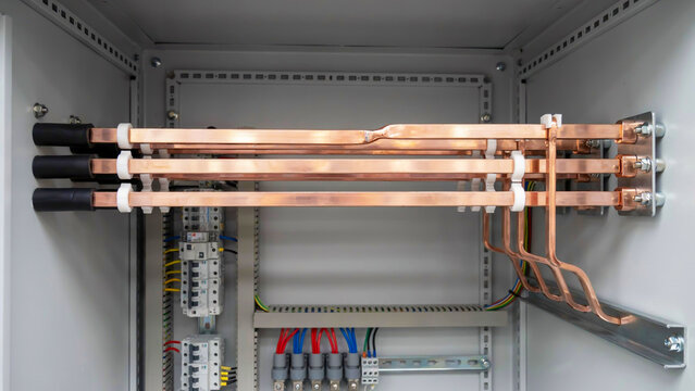 Copper busbars and electrical wiring inside metal enclosure industrial equipment electrical engineering