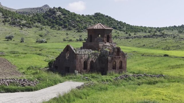 Drone Footage of Kizil Kilise in Guzelyurt Aksaray Turkey Showing Early Christian Red Stone Church and Anatolian Landscape
