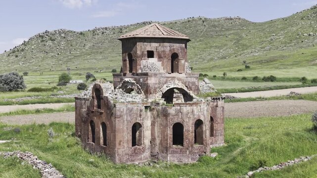 Drone Footage of Kizil Kilise in Guzelyurt Aksaray Turkey Showing Early Christian Red Stone Church and Anatolian Landscape