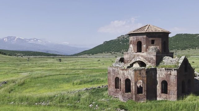 Drone Footage of Kizil Kilise in Guzelyurt Aksaray Turkey Showing Early Christian Red Stone Church and Anatolian Landscape
