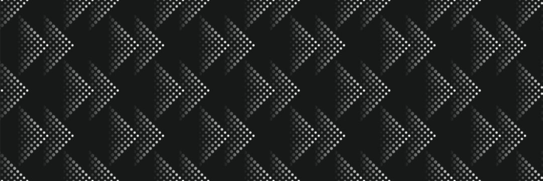 Seamless pattern with hexagonal soccer ball texture forming arrow shapes on black background. Futuristic sports geometric wallpaper.