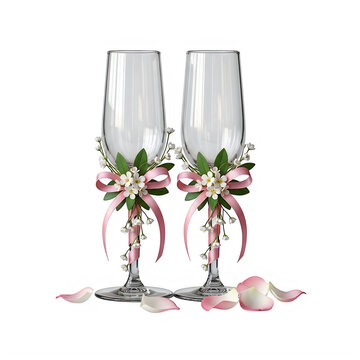 Two decorated wedding champagne flutes with pink ribbons on transparent background with green leaves
