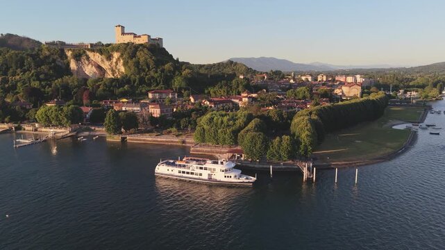Aerial View of Lake Maggiore Ferry with Angera Castle at Golden Hour