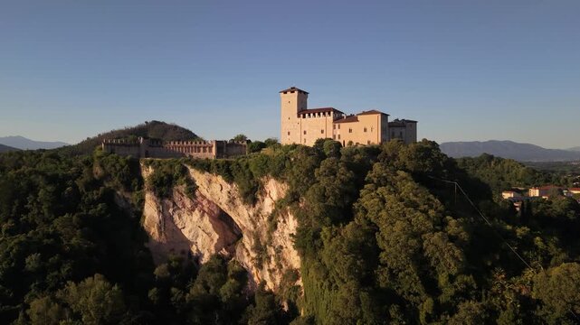 Golden Hour Drone Shot of Angera Castle Above Lake Maggiore Village