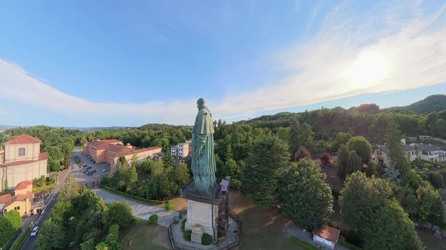 Sunset Aerial Shot of San Carlone Monument and Gardens in Arona