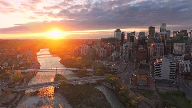 Forward drone flight over Bow River sunrise in Calgary