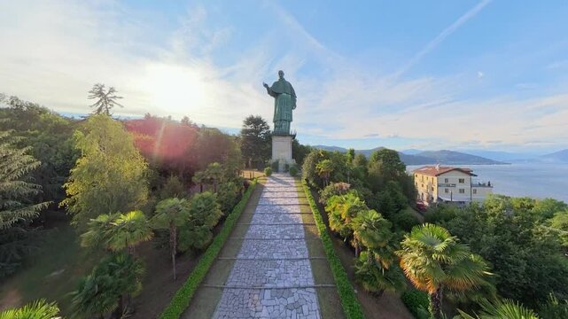 Aerial Sunset View of San Carlone Statue in Arona Overlooking Lake Maggiore