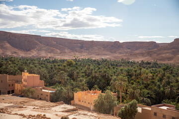 Obraz premium Small village in a valley with an oasis, on the highway to Merzouga, Morocco