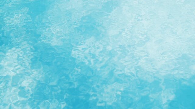 Ripples waves on the water of the pool, transparent, sparkling, inviting surface of the water in motion, view from above. Slow motion and looped video.