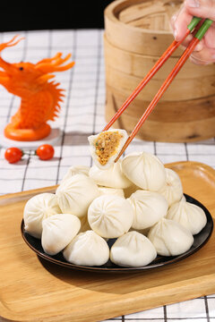 Xiaolongbao Chinese Soup Dumplings with Chopsticks - Traditional Asian Dim Sum Breakfast