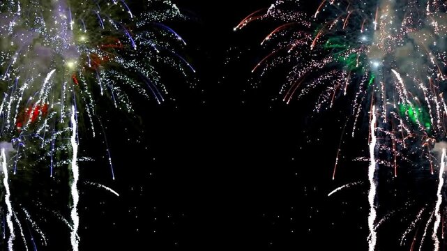 Vibrant blue and red fireworks bursting on opposite sides of a dark night sky, perfect for festive frames, holiday celebrations, and New Year.