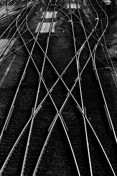 Railway tracks and switches at a big station forming geometrical and symmetrical structures and lines. Main station in Hagen Westphalia Germany. Black and white