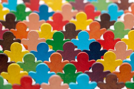Colorful painted group of wooden people figures