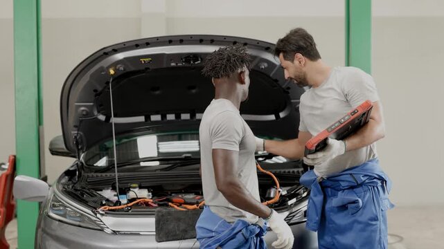Profession EV Car auto service, Monitor checkup battery balancing in Electric vehicle garage auto workshop