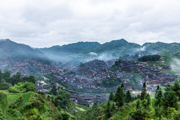 Fototapeta premium Xijiang Miao Village in Morning Mist, Guizhou China